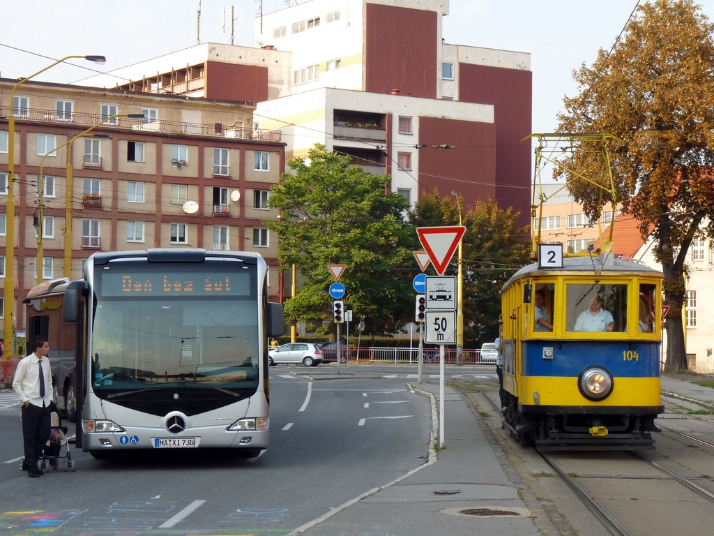 Meeting of the historical transport vehicle - tram and the new type of bus